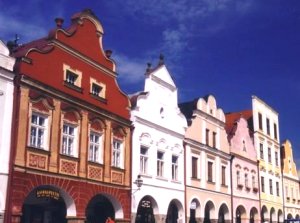 Telc facades in rust, white, pink and orange
